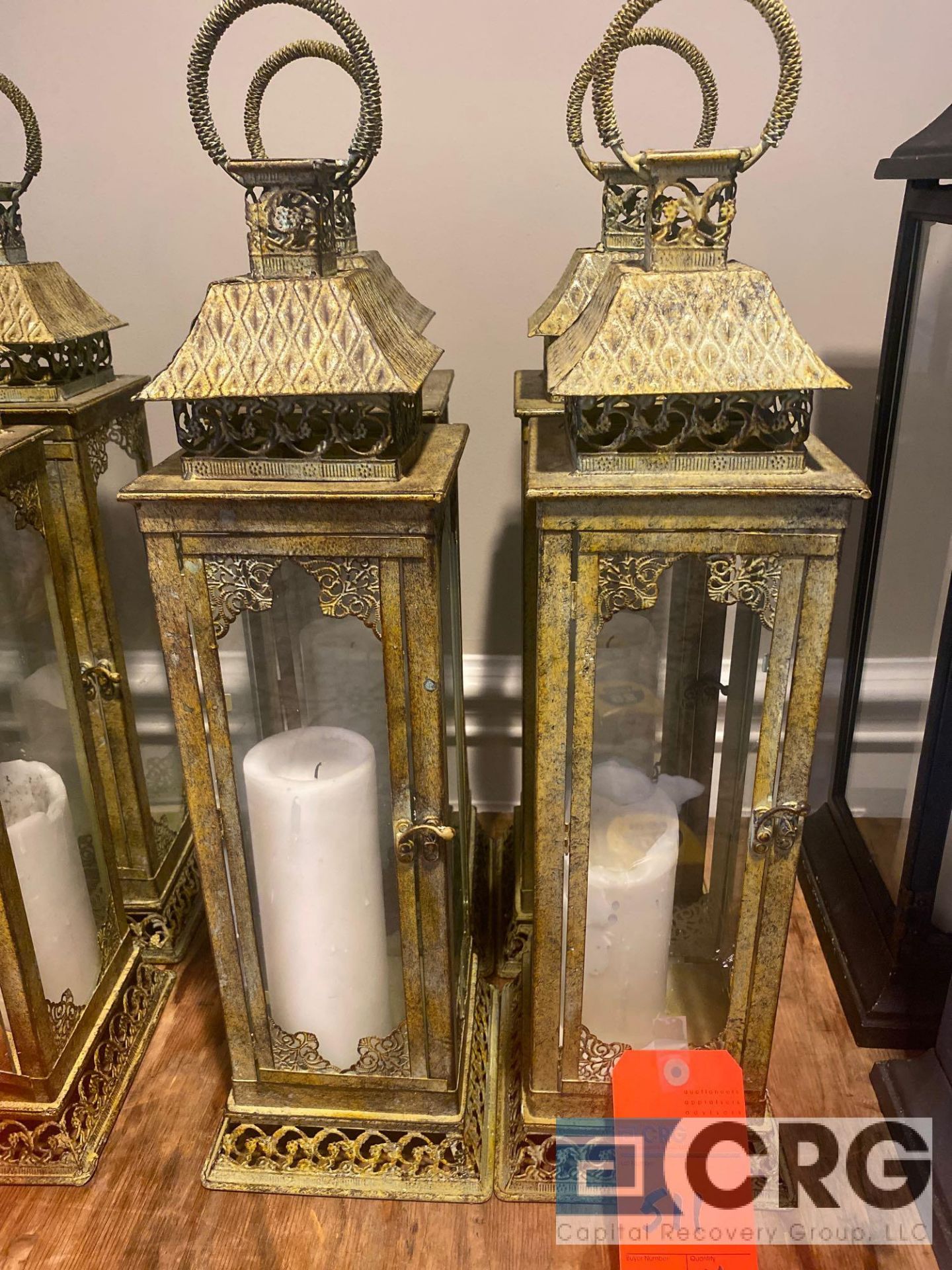 Lot of (4) decorative candle lanterns 7 inch X 7 base and 26 inches tall