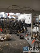 Lot of brass wedding decor including (2) arches, (4) candl holders and (4) plant stands