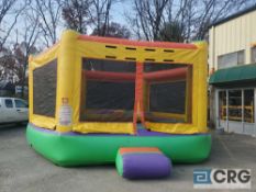 Gladiator inflatable bounce house with blower.