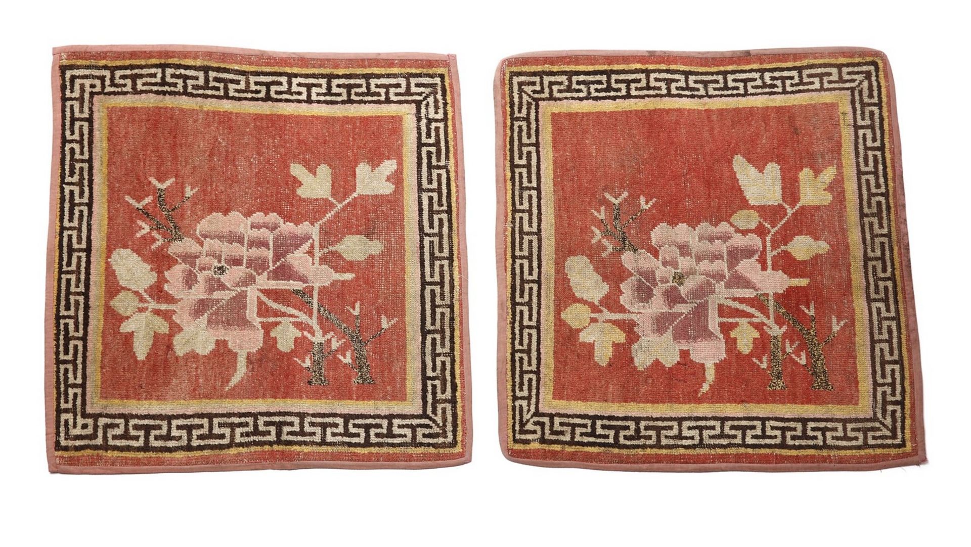 Arte Himalayana A pair of seat carpets decorated with peonies over red ground Tibet, 19th century .
