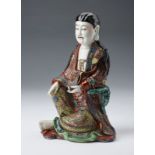 Arte Cinese A porcelain seated figure China, early 20th century .