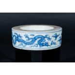 Arte Cinese A porcelain blue and white inkwell element painted with dragons chasing the flaming pea