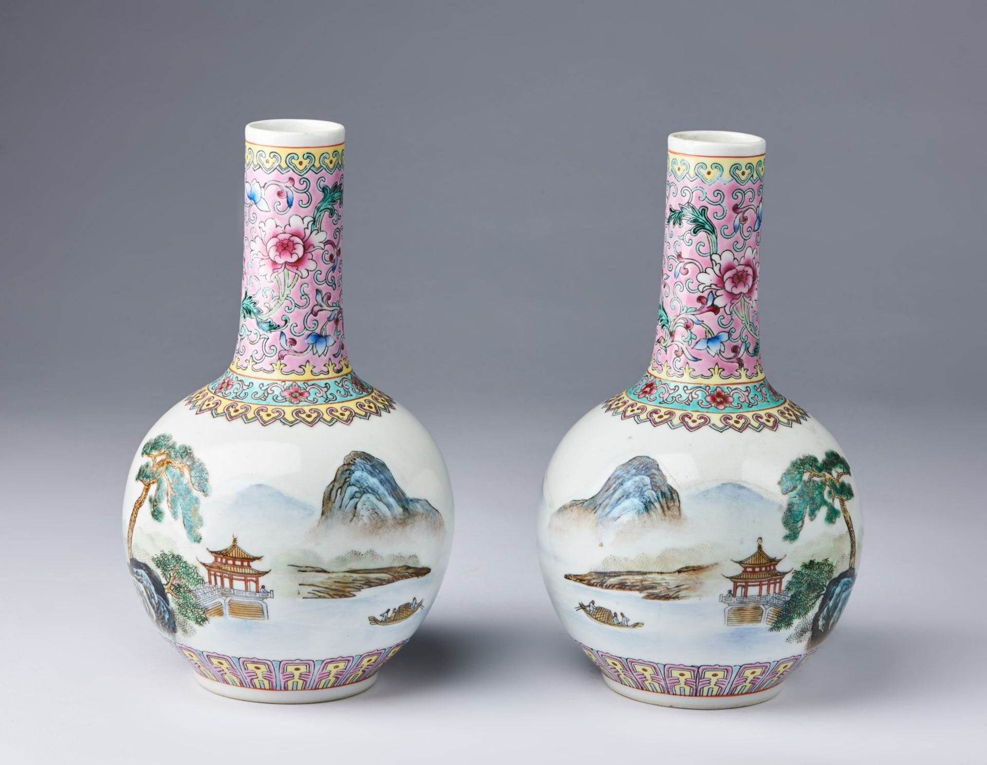 Arte Cinese A pair of famille rose porcelain tianchuping vases painted with landscape and bearing a