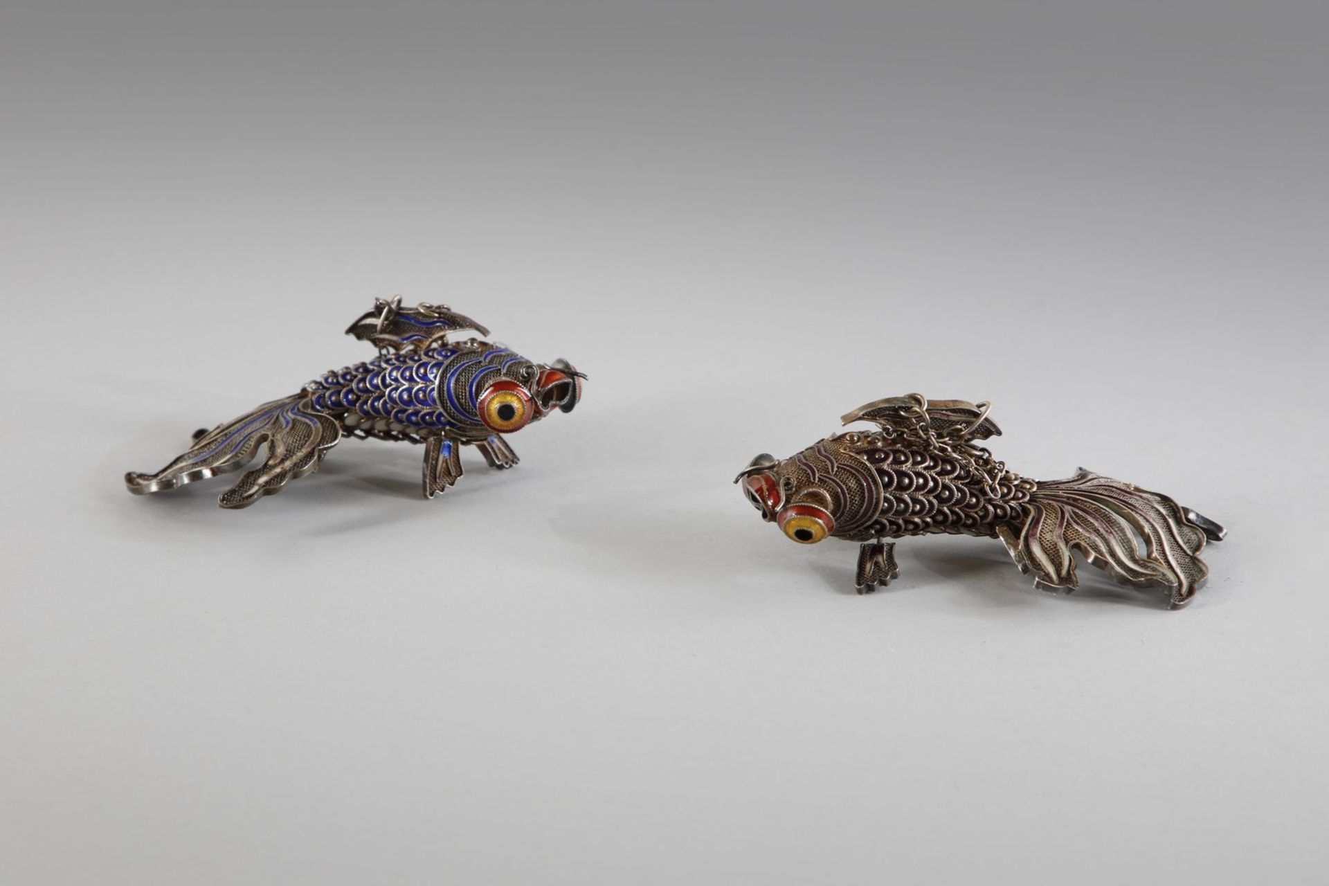 Arte Cinese A pair of silver enameled fishes China, early 20th century .