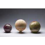 Naturalia Three coloured hard stone spheres Italy, 20th century .