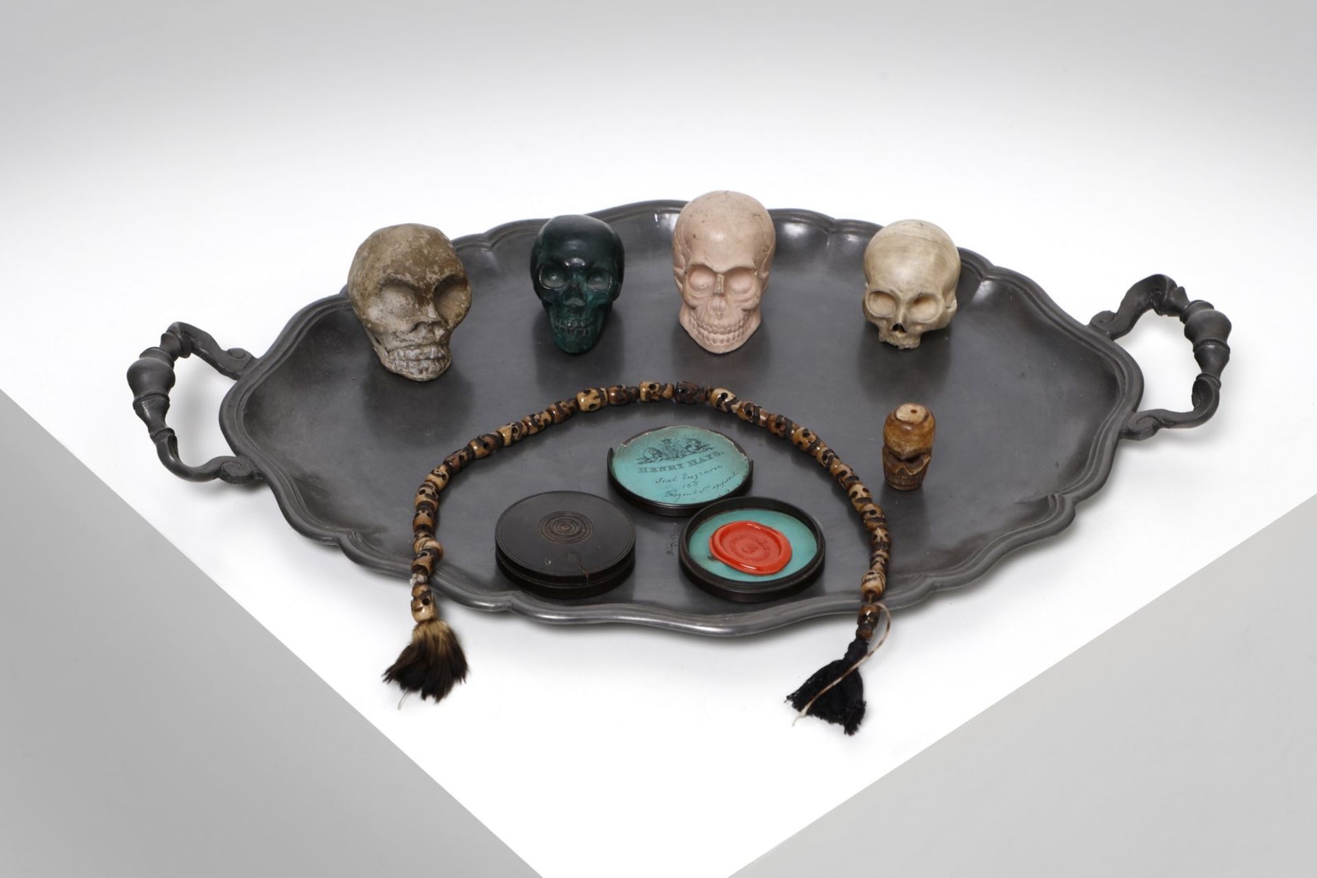 Wunderkammer Tray with small memento mori skulls and other objectsEurope.