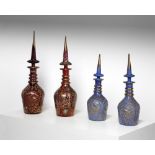 Arte Islamica A group of four gilded enamelled glass bottles Bohemia, 19th century .
