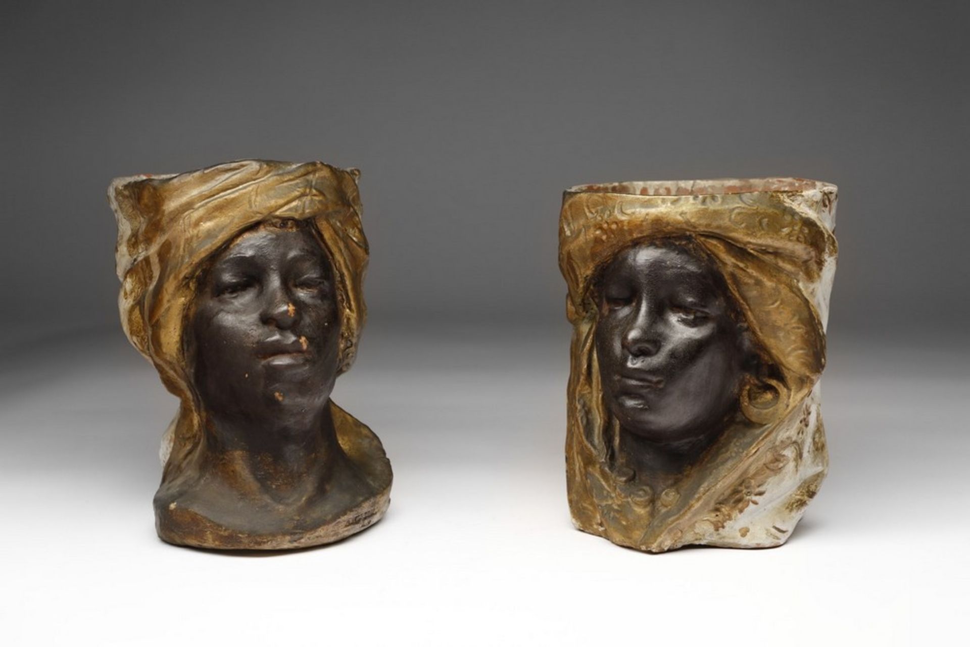 Arte Islamica A polychome earthenware Moor heads vases Southern Italy, 19th century .