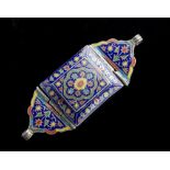 Arte Islamica A metal enamelled bazu band decorated with flowers over blue ground Central Asia, 19t