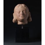 Arte Indiana A two-facetd stone female head India, Gupta period or later .