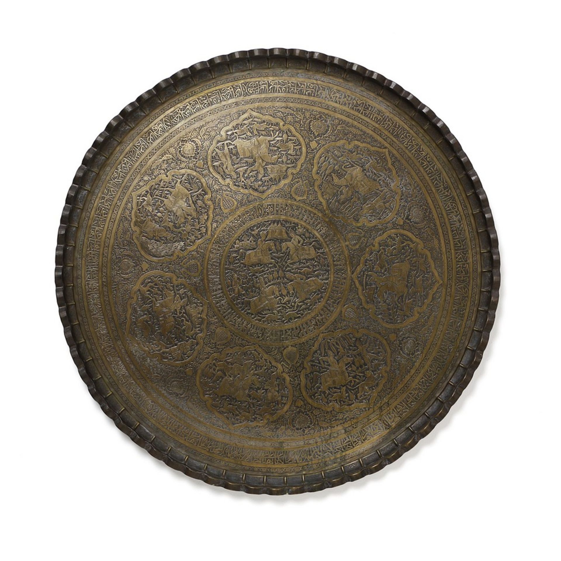 Arte Islamica  A large Persian brass charger decorated with characters and inscriptions Iran, 20th c