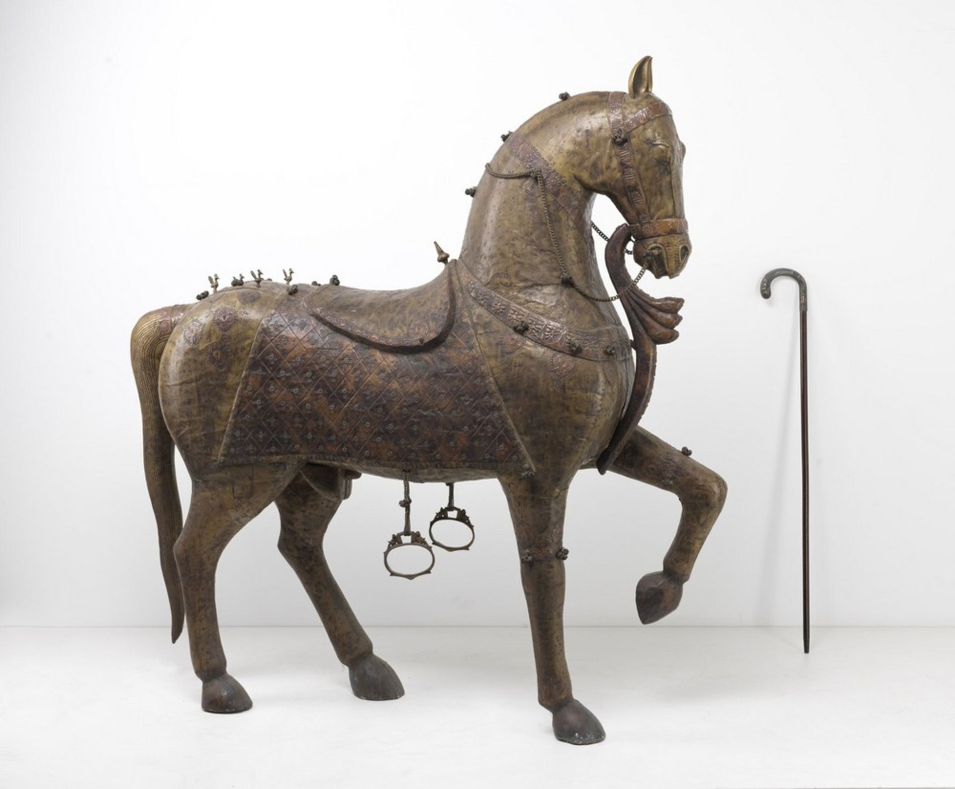 Arte Indiana A highly decorative large wooden horse coated with embossed and engraved copper sheetN