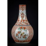 Arte Cinese A small porcelain vase painted with enameled blue underglaze and red overglaze, bearing