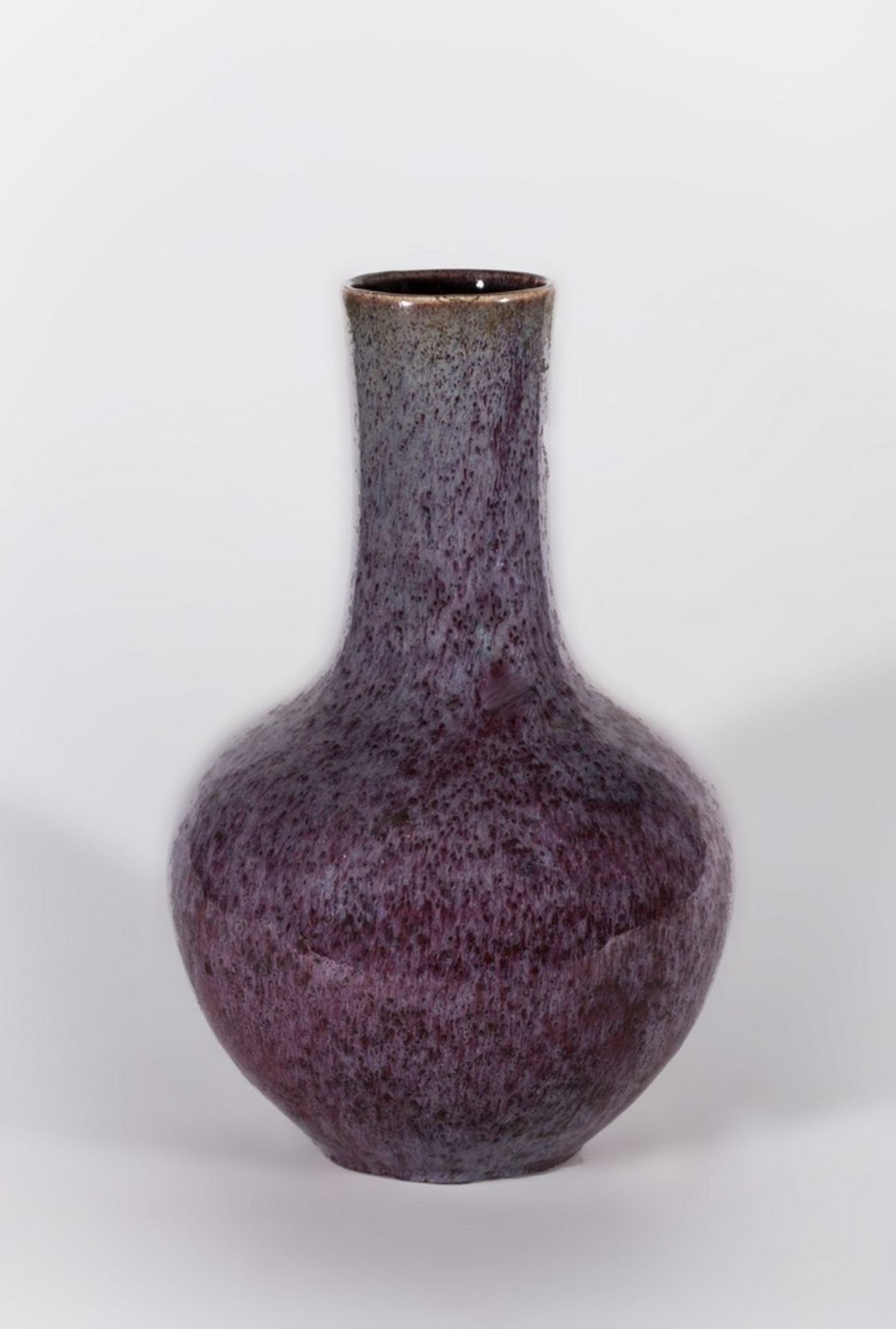 Arte Cinese A pottery flambé glazed lavander and red bottle vase China, late 19th century.