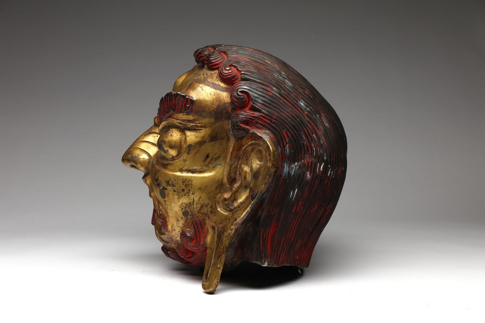 Arte Himalayana A large gilded copper embossed head of Mahakala Tibet, 19th century . - Image 2 of 3