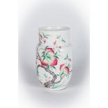 Arte Cinese A porcelain famille rose vase painted with peaches and a bat and bearing a mark at the