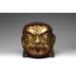 Arte Himalayana A large gilded copper embossed head of Mahakala Tibet, 19th century .