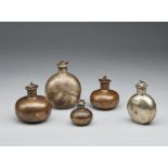 Arte Indiana A group of five pilgrim metal flasks Northern India, 19th century .