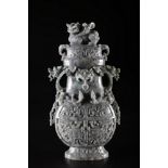 Arte Cinese A grey jadeite carved vase with archaic shape and decoration of taotie masks, chilong s