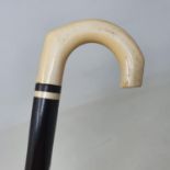 A walking stick, with a carved ivory handle, 82 cm