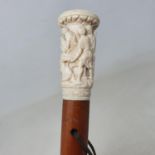 A 19th century walking stick, the ivory handle, carved Christ's removal from the cross by the