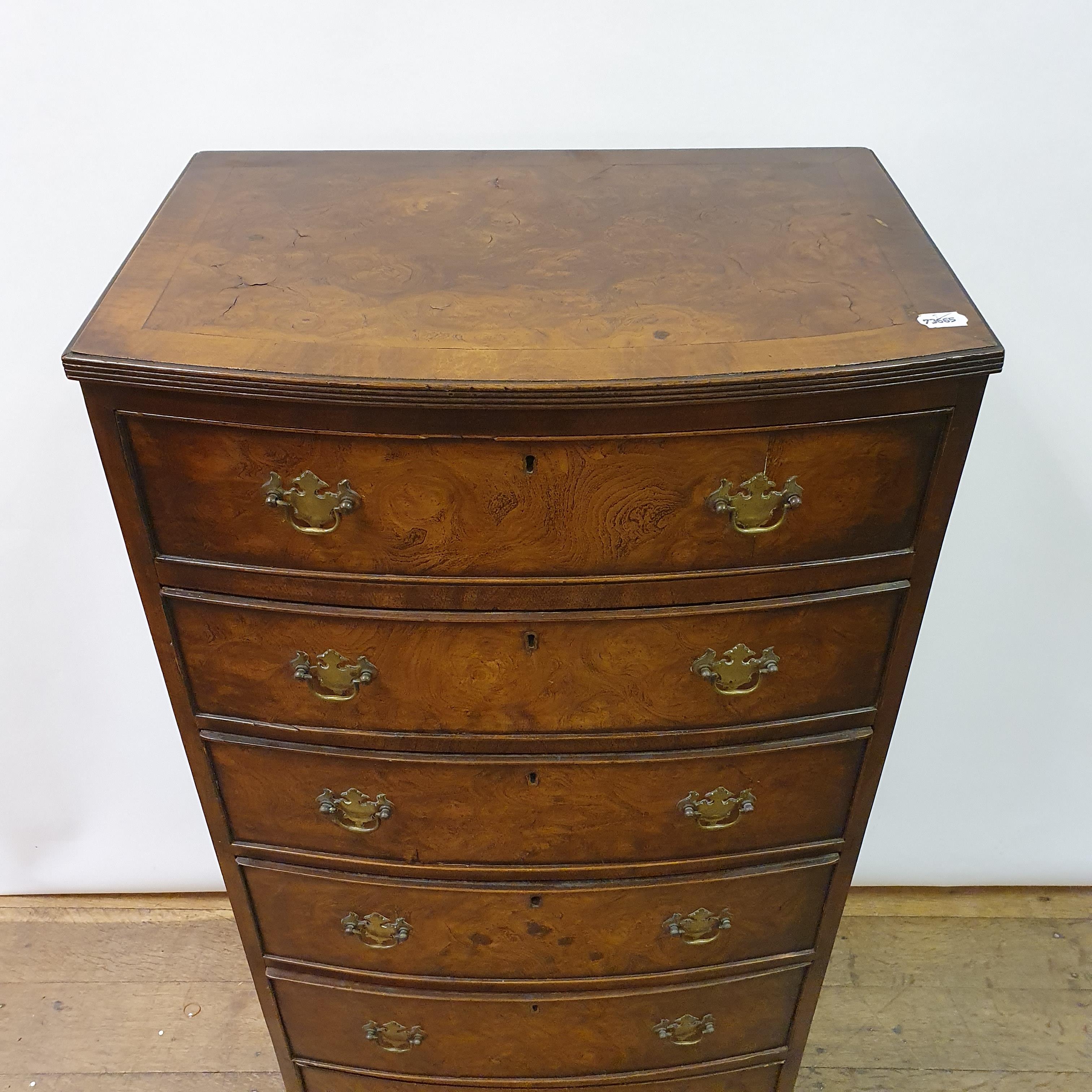 A walnut bow fronted chest, having six drawers on bracket feet, 60 cm wide - Image 2 of 6