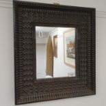A 17th century style wall mirror, the ebonised frame with zig-zag style decoration, 48 x 43 cm