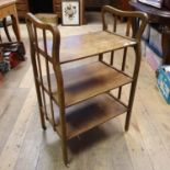 An Arts and Crafts oak trolley, 53 cm wide