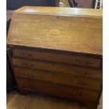 A mahogany bureau, 90 cm wide, a set of four 19th century mahogany dining chairs, and two others (7)