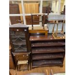 A mahogany bookcase, 103 cm, two stools, a mahogany side table, a mahogany corner cabinet, a