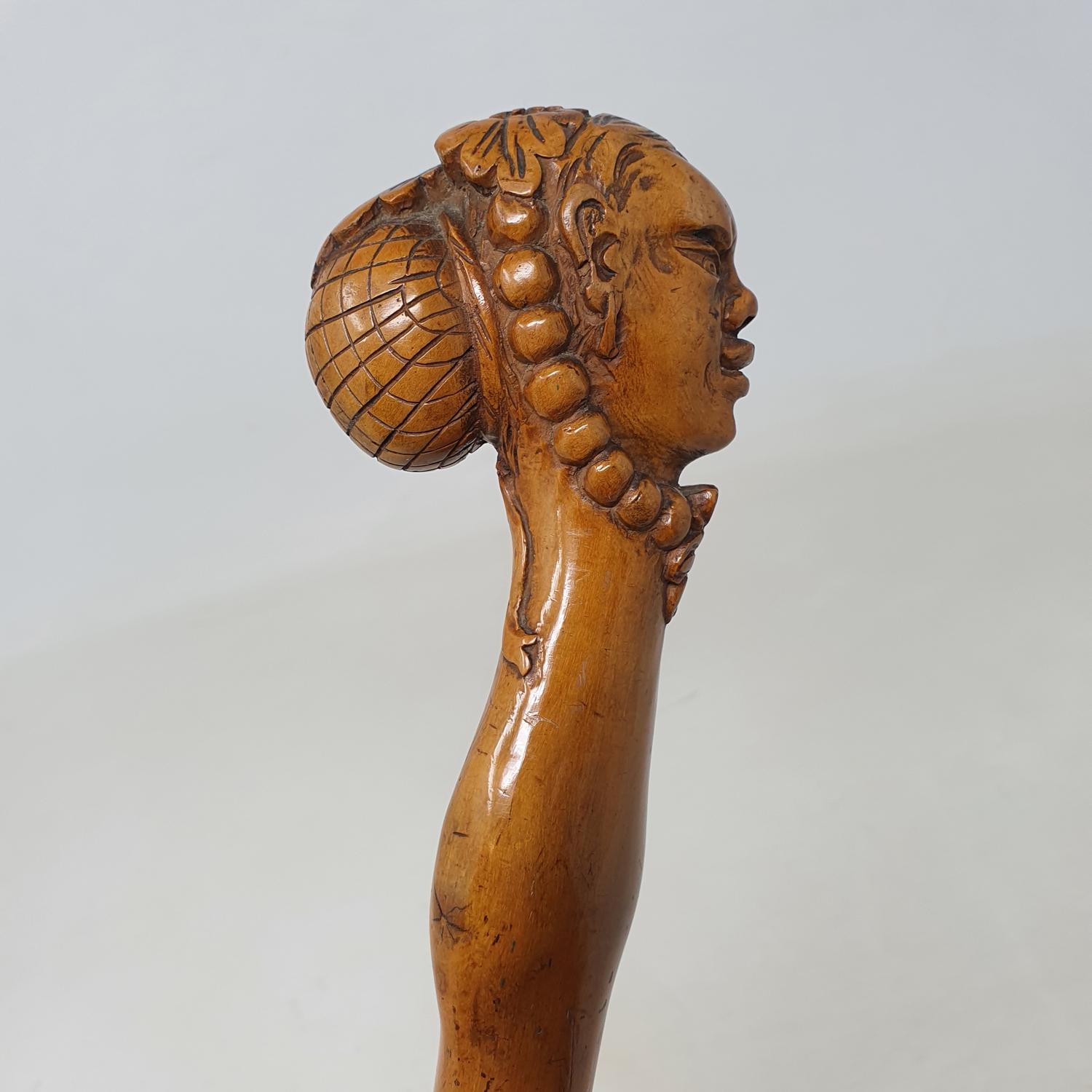 A 19th century folk art walking stick, the carved handle in the form of a lady in a bonnet and - Image 5 of 8