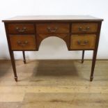 A 19th century mahogany kneehole dressing table, having five drawers, on square tapering legs, 110