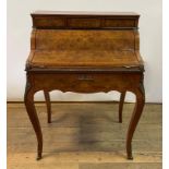 A Louis XV style bureau de dame, veneered in burr walnut, the superstructure with three drawers