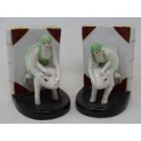 A pair of modern bookends, in the form of women riding pigs, 15 cm high