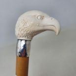 A 19th century walking stick, with carved ivory handle in the form of an eagle, on Malacca shaft, 93