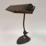 A bankers lamp, on a heart shaped base