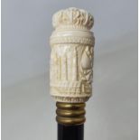 A 19th century walking stick, the ivory handle carved the Taj Mahal and foliate forms, top