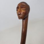 A folk art walking stick, the handle carved in the form of a male head, 106 cm