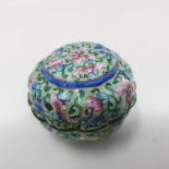 A Canton enamel pot and cover, decorated flowers on a green ground, 3 cm diameter