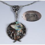 A Joseph Anton Hodel (1874-1930) Art Nouveau silver coloured metal and opal pendant on a chain,