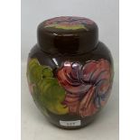 A Moorcroft pottery hibiscus pattern ginger jar and cover, 20 cm high