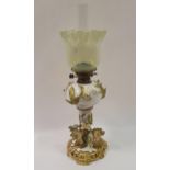 An oil lamp, opaque glass shade, with Dresden porcelain body, with applied flowers, highlighted in