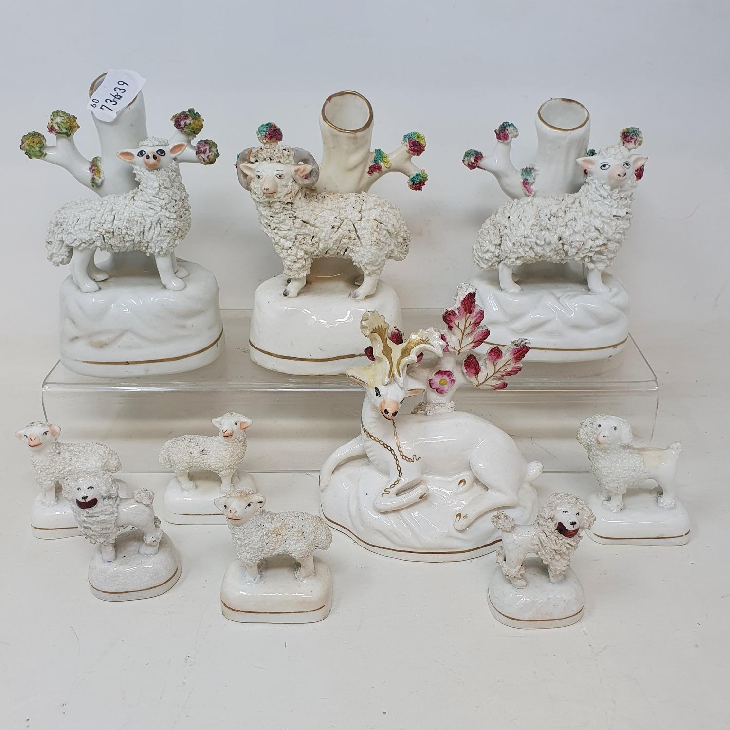 A pair of 19th century Staffordshire quill holders, applied sheep, and twenty other Staffordshire