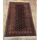 An Afghan red ground rug, 156 x 144 cm, a tribal rug, 146 x 93 cm, two prayer rugs, 62 x 41 cm and a