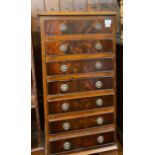 A mahogany chest, having six drawers, 46 cm wide, an oak bookcase, a teak wall shelf, a mirror,