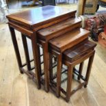 A nest of four Chinese hardwood tables, the largest 50.5 cm wide