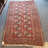 An Afghan red ground rug, 195 x 122 cm, and a tribal rug, 188 x 135 cm