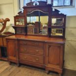 An early 20th century mahogany sideboard, with a mirrored back, the a base with three drawers
