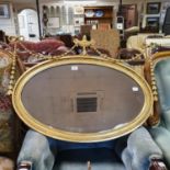 An oval gilt wall mirror, with a vase finial, 90 cm wide, and another mirror (2)