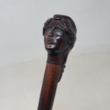 A walking stick, with carved hardwood handle in the form of a lady with long hair, 90 cm